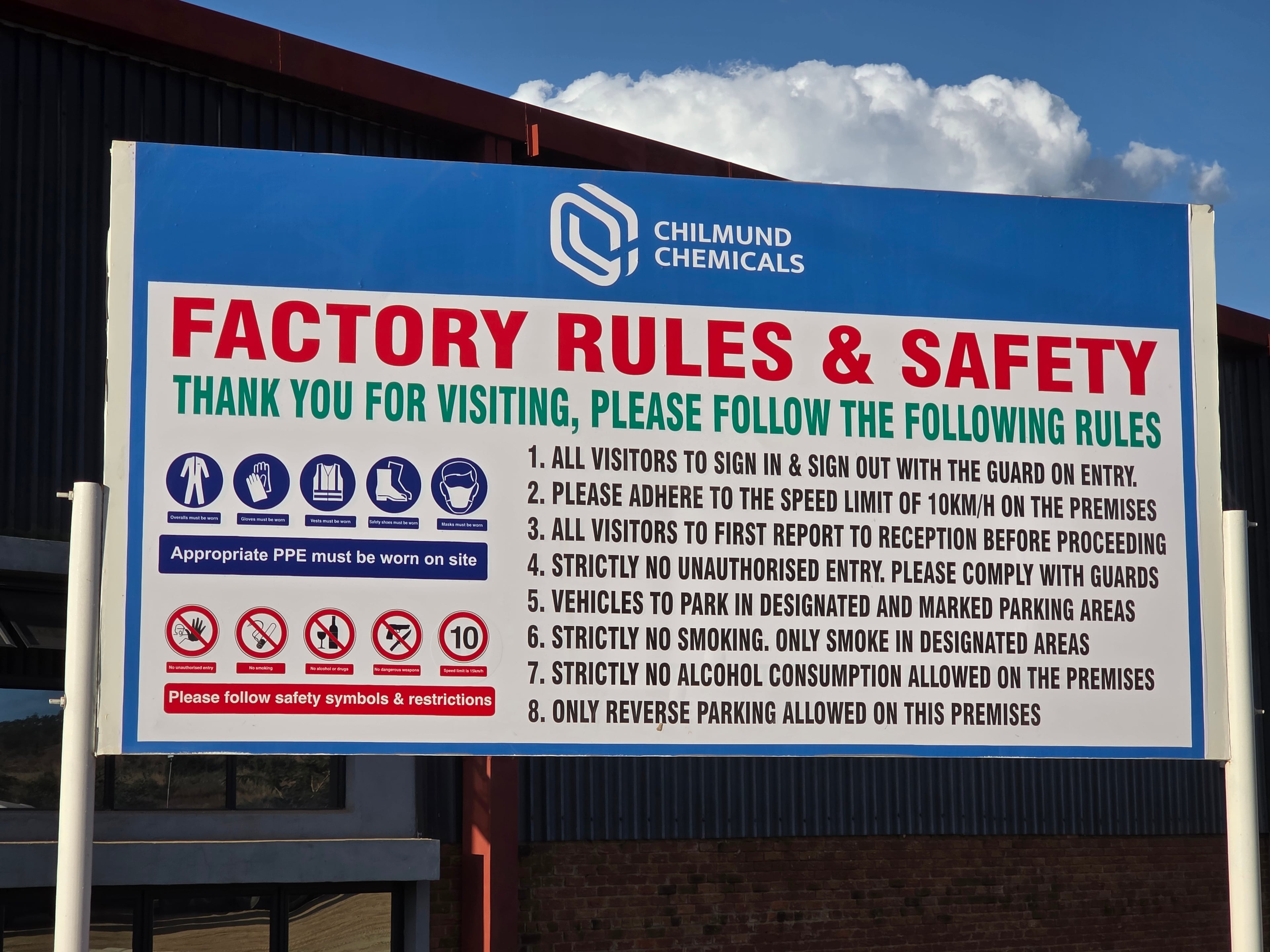 Chilmund Chemicals factory rules and safety board at the plant entrance.