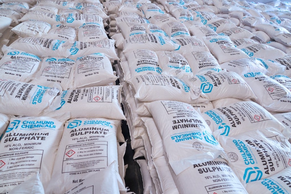 Chilmund Chemicals product warehouse with stacked aluminium sulphate bags.